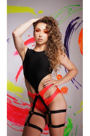 Harness pole dance top in black with black elastic thigh straps, front view