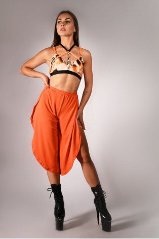 Witch top in orange, styled with boho pants, colorful strap pole dance top outfit