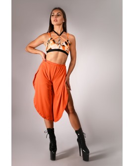 Witch top in orange, styled with boho pants, colorful strap pole dance top outfit