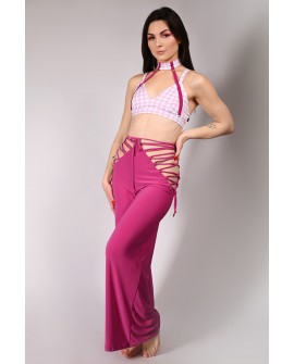 Wren Yoga Pants in red plum, side view showing lace-up sides and fluid fabric