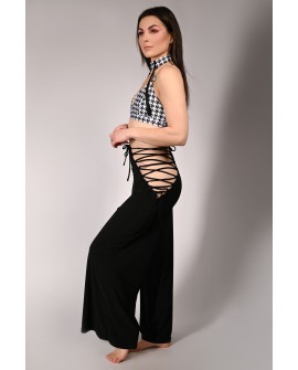 Wren Yoga Pants in black, side view showing lace-up sides and fluid fabric