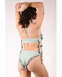 Lily high waisted flounce dance shorts in sage green exposing buttocks, back view