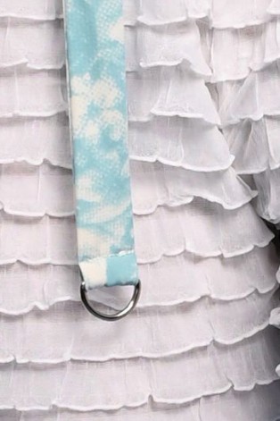 Close-up detail of Stays Top showcasing decorative metal half-rings inspired by Victorian garter fastenings
