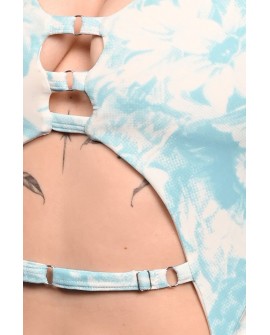 Close-up detail of Poetry Bodysuit showcasing blue rose print, decorative straps and elegant cut-out design