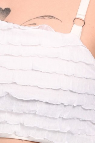 Close-up of Elinor Top showing delicate Victorian-inspired ruffle layers and premium fabric detail