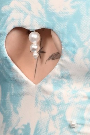 Close-up of Victorian Corset Top showing pearl embellishments, heart-shaped cut-out detail