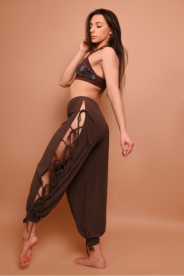 Crystal dance pants with dramatic side openings and multiple adjustable ties, in brown, side view