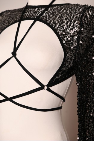 Witch Top in black, close-up of sparkling sequins, sheer mesh and decorative front tie straps