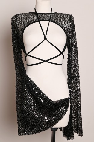 Witch Top in black, asymmetrical sheer sequin fabric with dramatic flared sleeves, three-quarter view