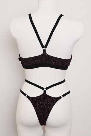 Starlight Set in black with purple sequins and glittery adjustable straps, open-back top and high-cut shorts, back view