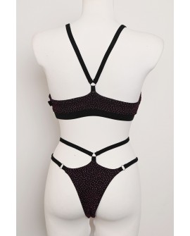 Starlight Set in black with purple sequins and glittery adjustable straps, open-back top and high-cut shorts, back view