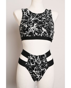 Splash Set black and white abstract pole dance outfit with patterned top and hip strap shorts, front view