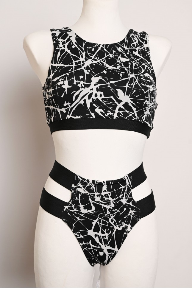 Splash Set black and white abstract pole dance outfit with patterned top and hip strap shorts, front view