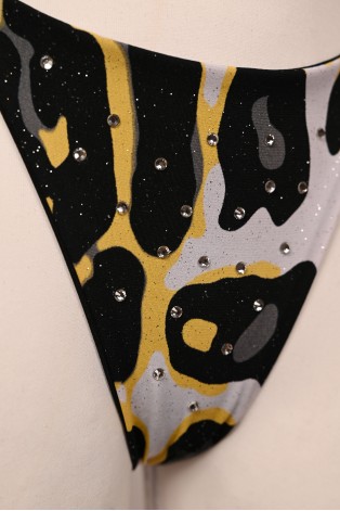 Close-up of Banana Bikini bottoms with yellow black and white print and sparkling rhinestones