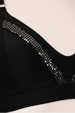 Close-up of Silver Rush black top with sparkling silver sequin trim and adjustable straps