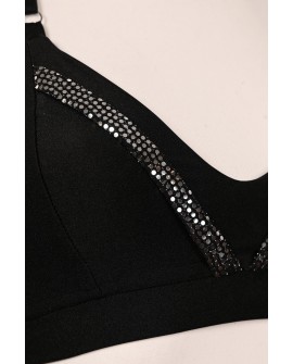 Close-up of Silver Rush black top with sparkling silver sequin trim and adjustable straps